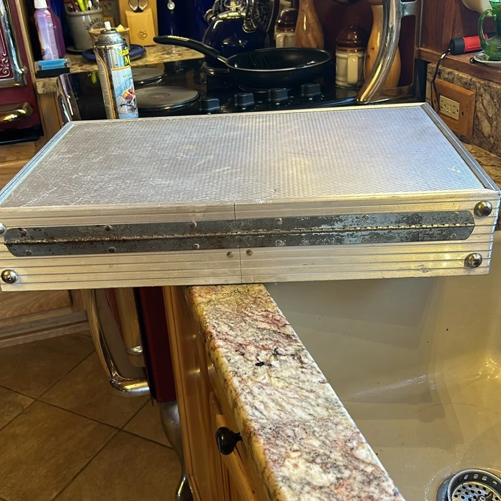 Aluminum padded case, handy for carrying anything; 24”long, 13.5”wide 4” deep